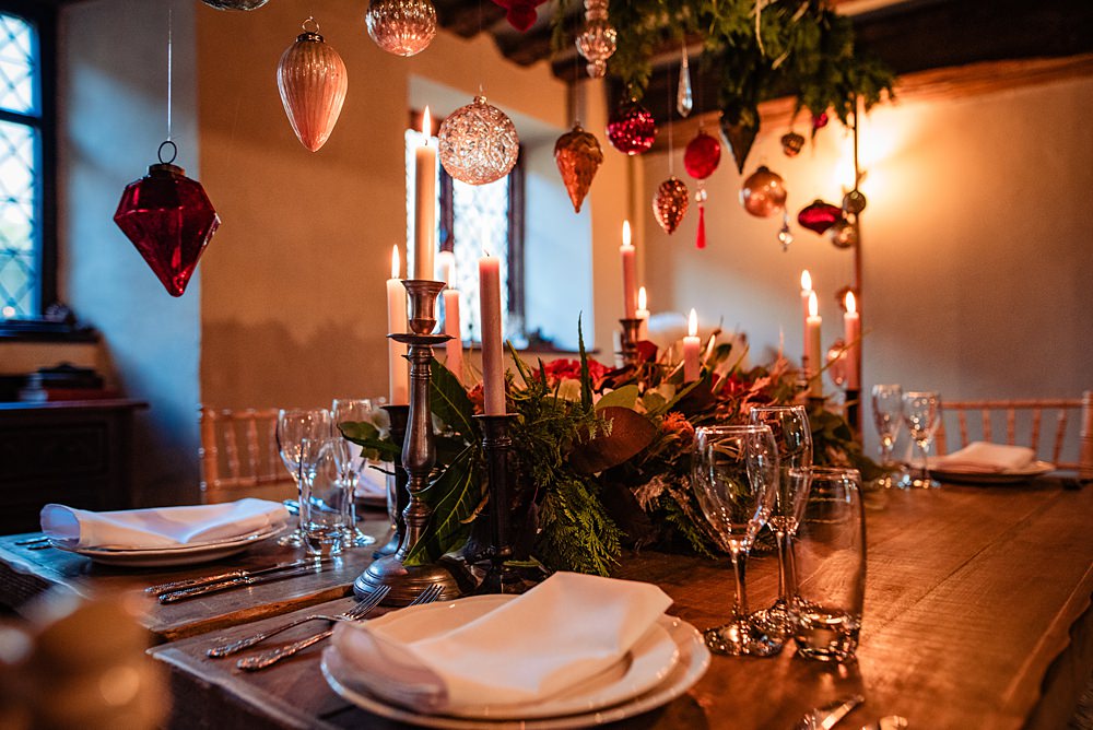 Vintage Winter Wonderland Wedding Ideas Natalia Case Photography Wooden Table Christmas Greenery Baubles Decor Candles Flowers