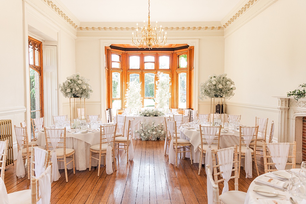 St Audries Park Wedding James and Kerrie Photography Round Tables Gypsophila White Rose Centrepieces