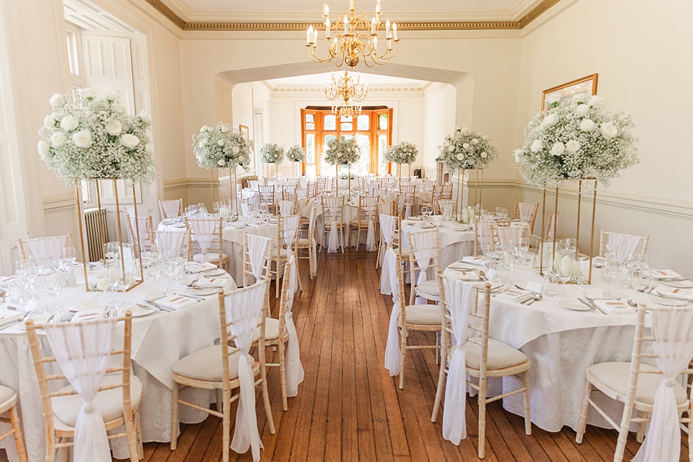 St Audries Park Wedding James and Kerrie Photography Round Tables Gypsophila White Rose Centrepieces