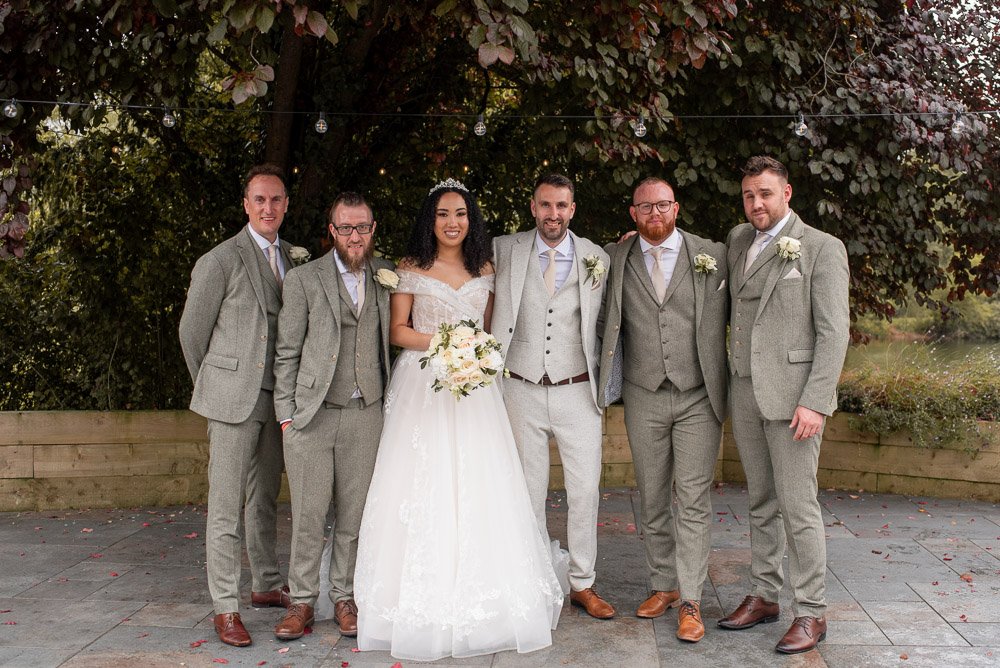 The Old Mill Aldermaston Wedding Nicola Belson Photography Cream Suit Pink Tie Groomsmen