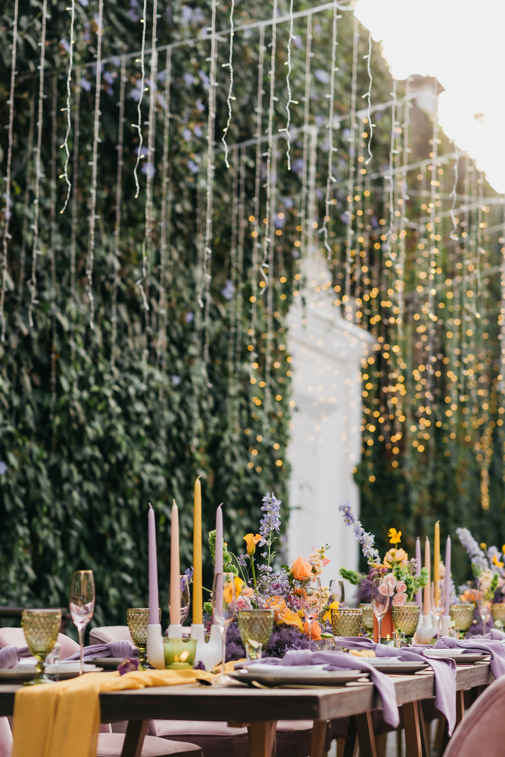 Antigua Guatemala Destination Wedding Daniel Lopez Perez Wedding Photography Fairy Lights Centrepiece Flowers Yellow Lilac decor Candles Table