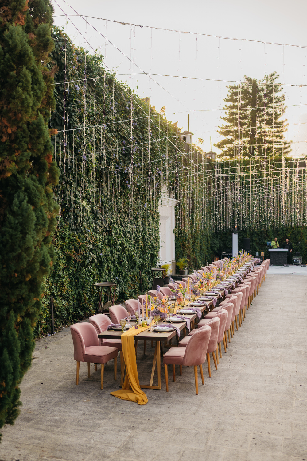 Antigua Guatemala Destination Wedding Daniel Lopez Perez Wedding Photography Fairy Lights Centrepiece Flowers Yellow Lilac decor Candles Table