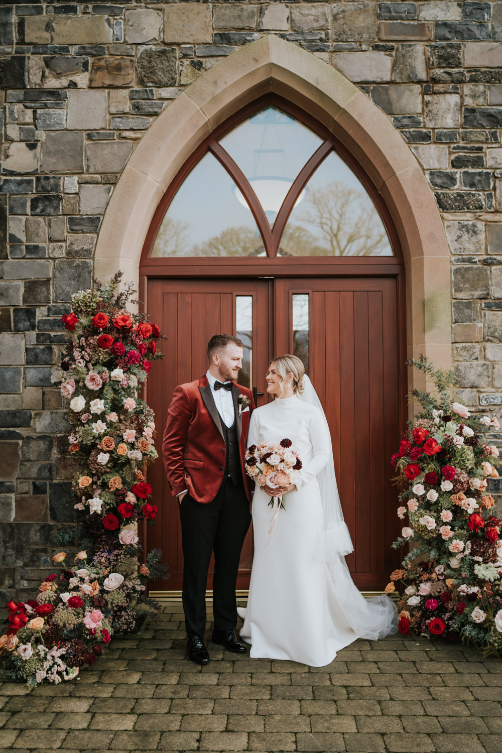Flowers Entrance Pillars Doorway Red Pink Orange Backdrop Tullyglass Hotel Wedding Sheena T Photography