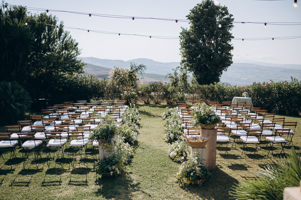 Baglio Strafalcello Wedding Anna Vlasiuk Photography Outdoor Ceremony Flowers Aisle Festoon Lights